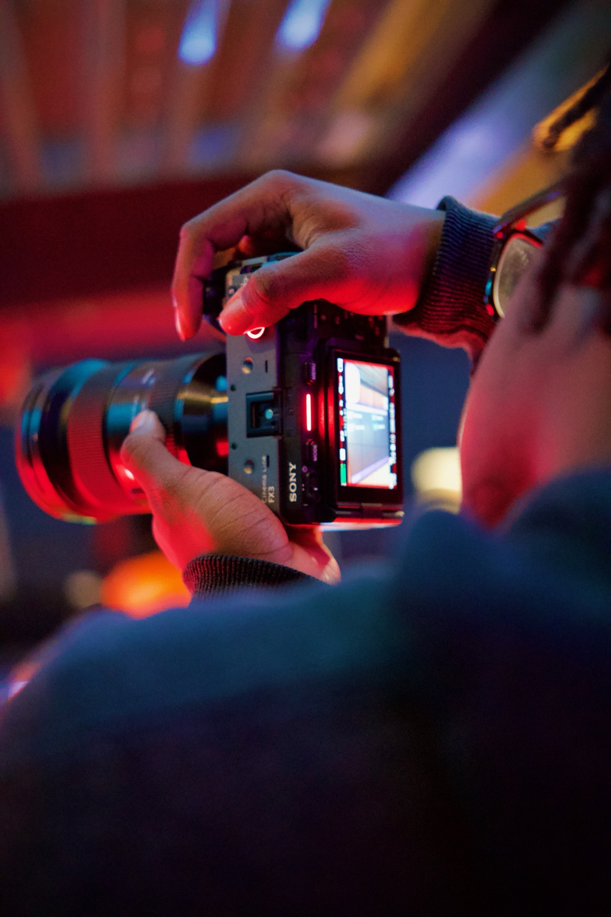 Run Da Mic founder and creative lead operating a cinema camera on set